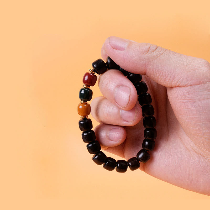 Pulsera de equilibrio de paz de palisandro de madera de ébano con Buddha Stones
