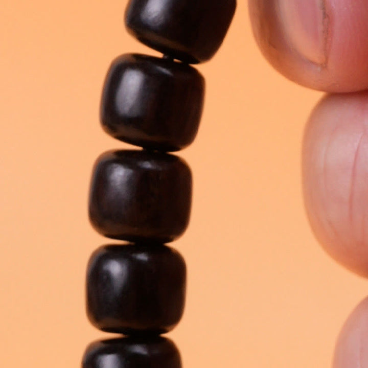 Pulsera de equilibrio de paz de palisandro de madera de ébano con Buddha Stones