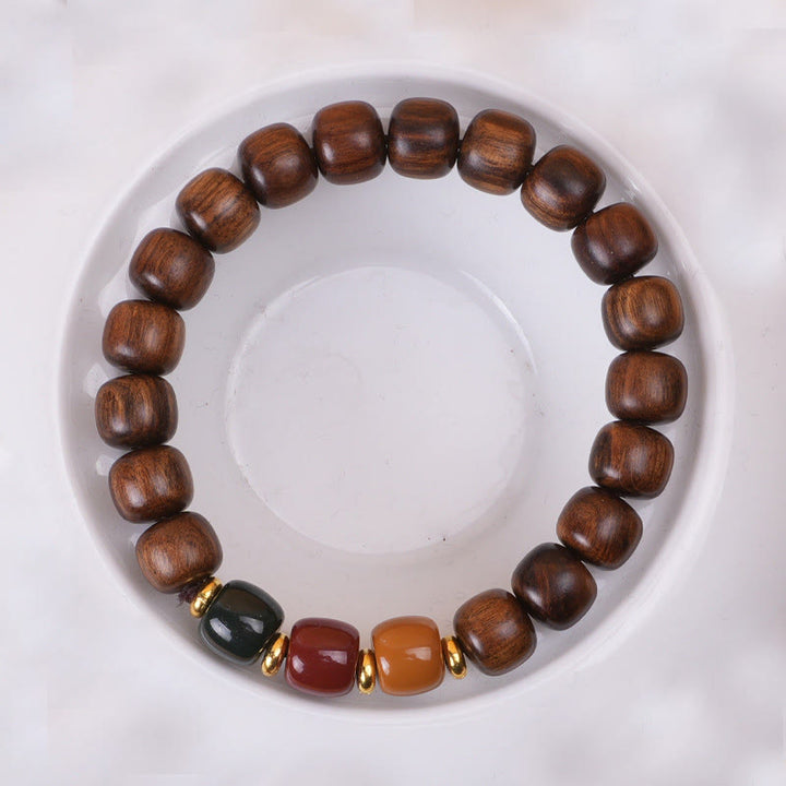 Pulsera de equilibrio de paz de palisandro de madera de ébano con Buddha Stones