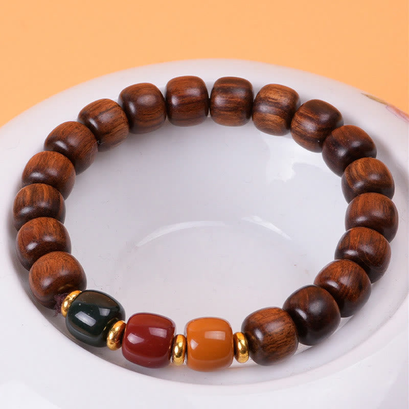 Pulsera de equilibrio de paz de palisandro de madera de ébano con Buddha Stones