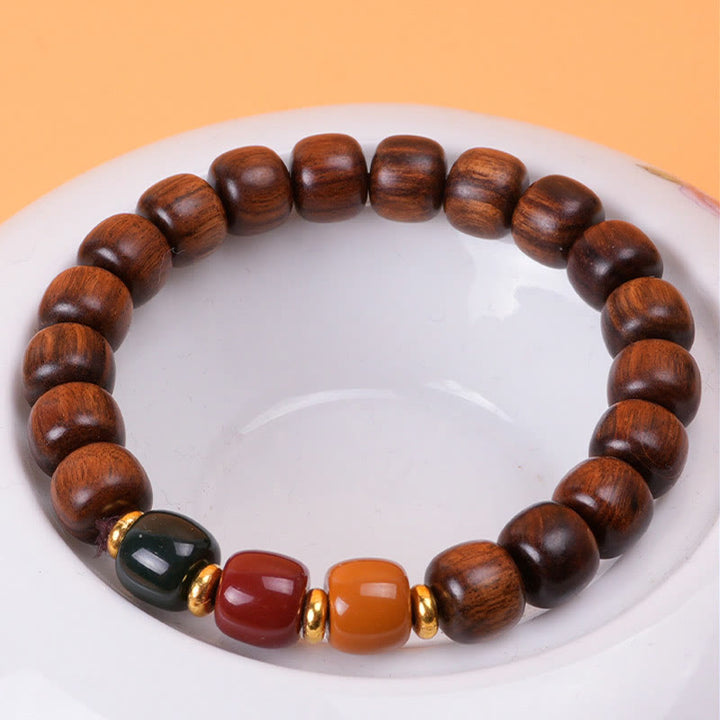 Pulsera de equilibrio de paz de palisandro de madera de ébano con Buddha Stones