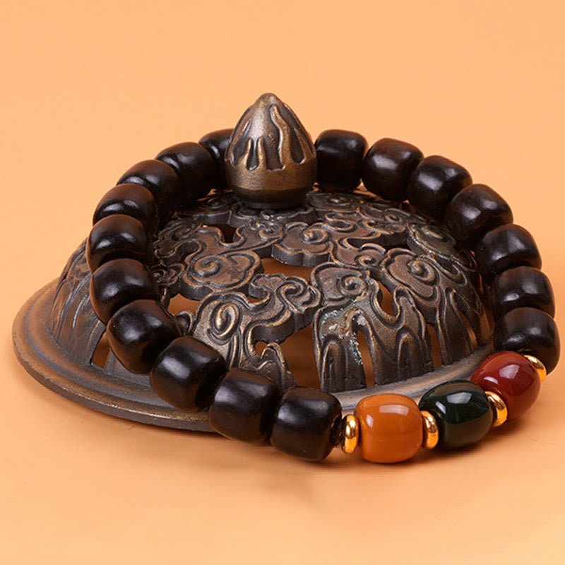 Pulsera de equilibrio de paz de palisandro de madera de ébano con Buddha Stones