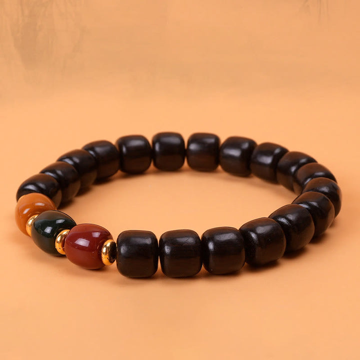 Pulsera de equilibrio de paz de palisandro de madera de ébano con Buddha Stones