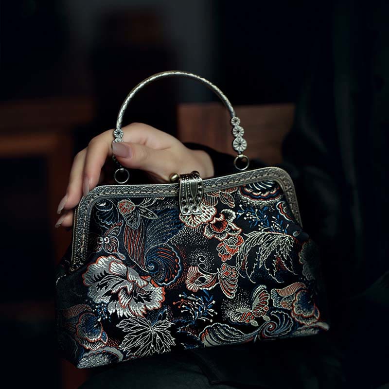 Bolso de mano con asa de metal y flores de mariposa y Buddha Stones