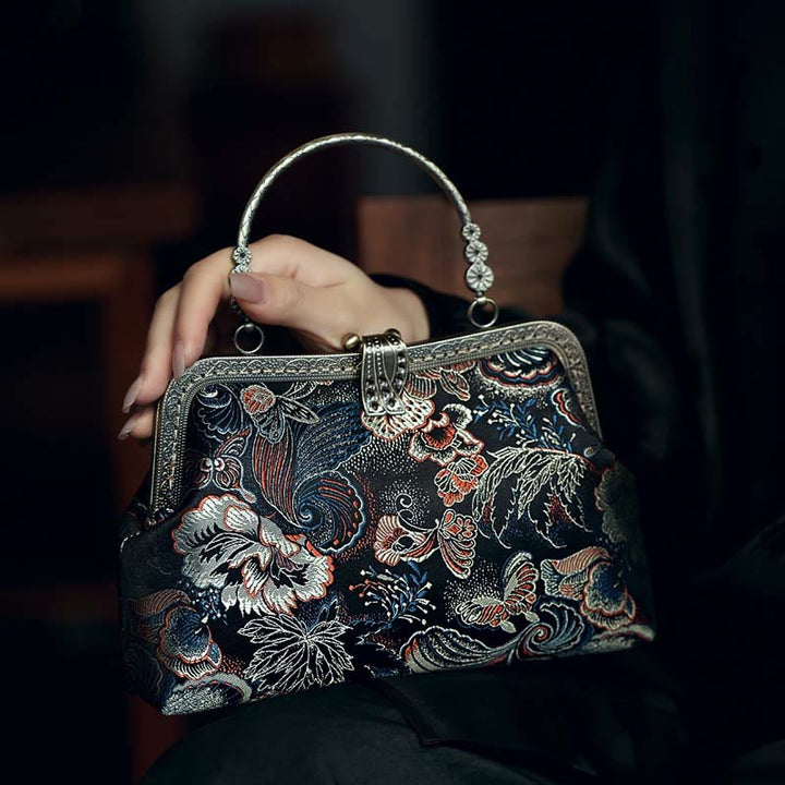 Bolso de mano con asa de metal y flores de mariposa y Buddha Stones