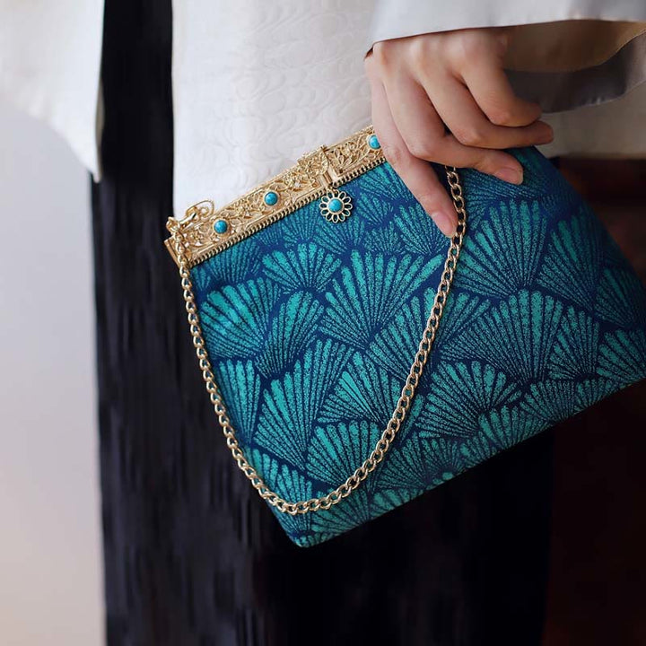 Bolso bandolera con cadena de metal con líneas azules y Buddha Stones