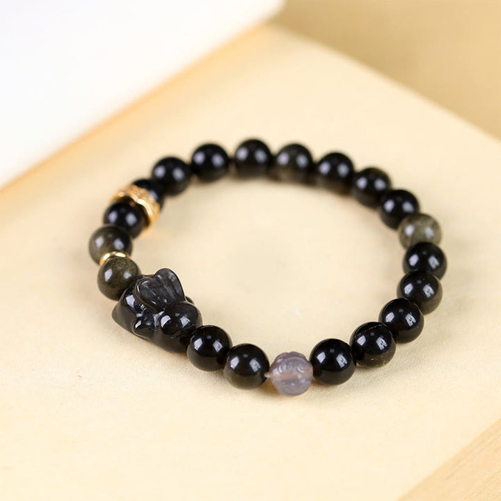 Buddha Stones Obsidiana con brillo dorado Obsidiana negra Obsidiana con brillo plateado Pulsera linda de protección de conejo