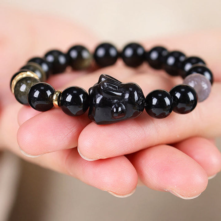 Buddha Stones Obsidiana con brillo dorado Obsidiana negra Obsidiana con brillo plateado Pulsera linda de protección de conejo