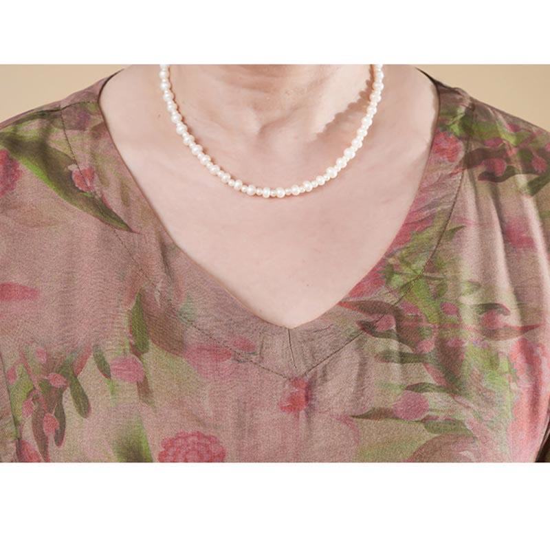 Vestido midi de lino y algodón de manga corta con flores y cuello en V de talla grande con bolsillos de Buddha Stones