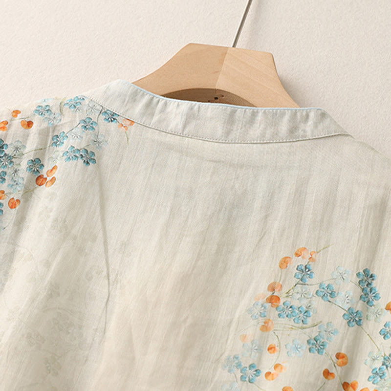 Camisa de manga tres cuartos con botones de rana, flores azules y Buddha Stones, con estampado de hojas naranjas y diseño de piedras de Buda. - image 4