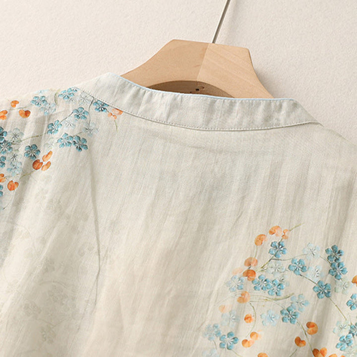 Camisa de manga tres cuartos con botones de rana, flores azules y Buddha Stones, con estampado de hojas naranjas y diseño de piedras de Buda. - image 4