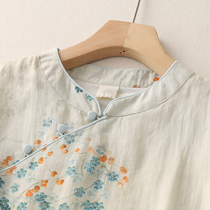 Camisa de manga tres cuartos con botones de rana, flores azules y Buddha Stones, con estampado de hojas naranjas y diseño de piedras de Buda. - image 2