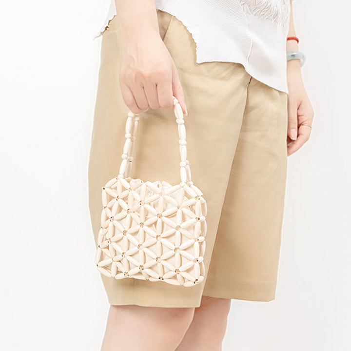 Bolso de mano de cuentas de madera tejidas a mano con piedras de Buda