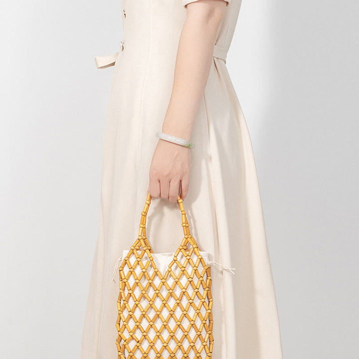 Bolso de mano de cuentas de madera huecas tejidas a mano con mallas de piedra de Buda
