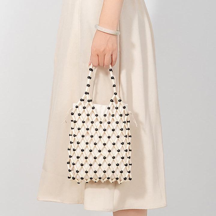Bolso de mano de cuentas de madera huecas tejidas a mano con mallas de piedra de Buda
