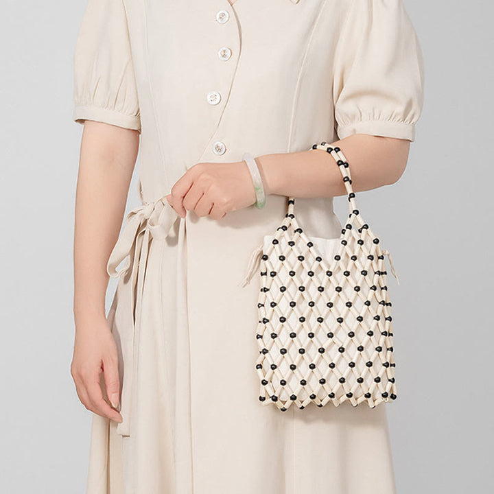Bolso de mano de cuentas de madera huecas tejidas a mano con mallas de piedra de Buda