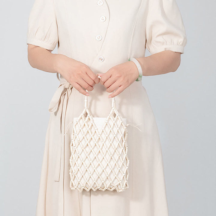 Bolso de mano de cuentas de madera huecas tejidas a mano con mallas de piedra de Buda