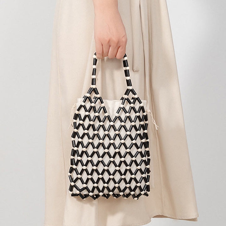 Bolso de mano de cuentas de madera huecas tejidas a mano con mallas de piedra de Buda