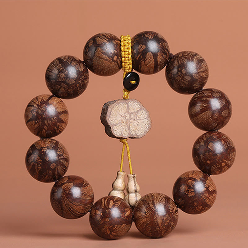 Pulsera de paz interior de madera de ciruelo con piedras de Buda