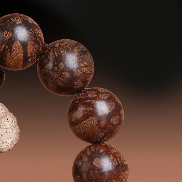 Pulsera de paz interior de madera de ciruelo con piedras de Buda