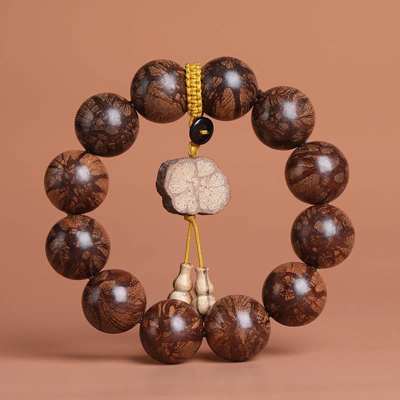 Pulsera de paz interior de madera de ciruelo con piedras de Buda