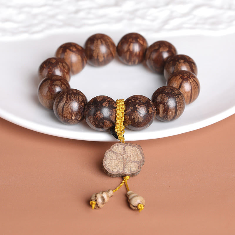Pulsera de paz interior de madera de ciruelo con piedras de Buda