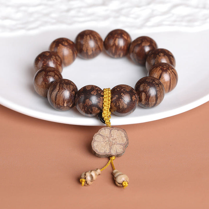 Pulsera de paz interior de madera de ciruelo con piedras de Buda