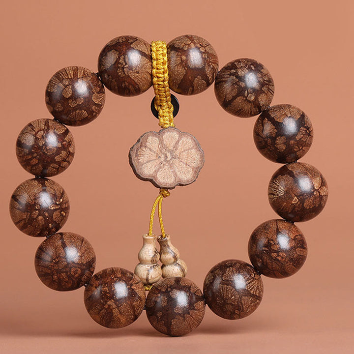 Pulsera de paz interior de madera de ciruelo con piedras de Buda