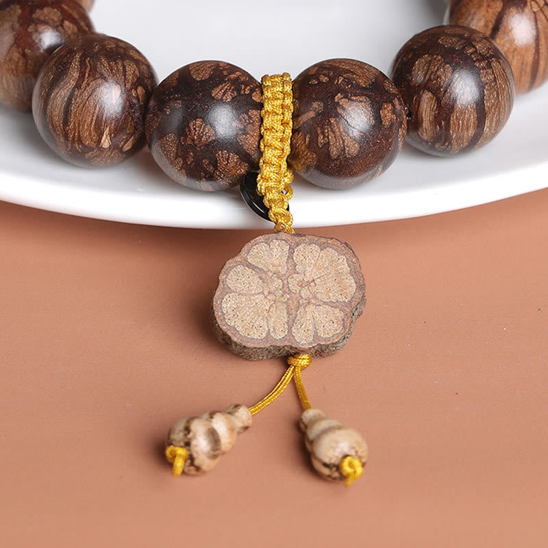 Pulsera de paz interior de madera de ciruelo con piedras de Buda