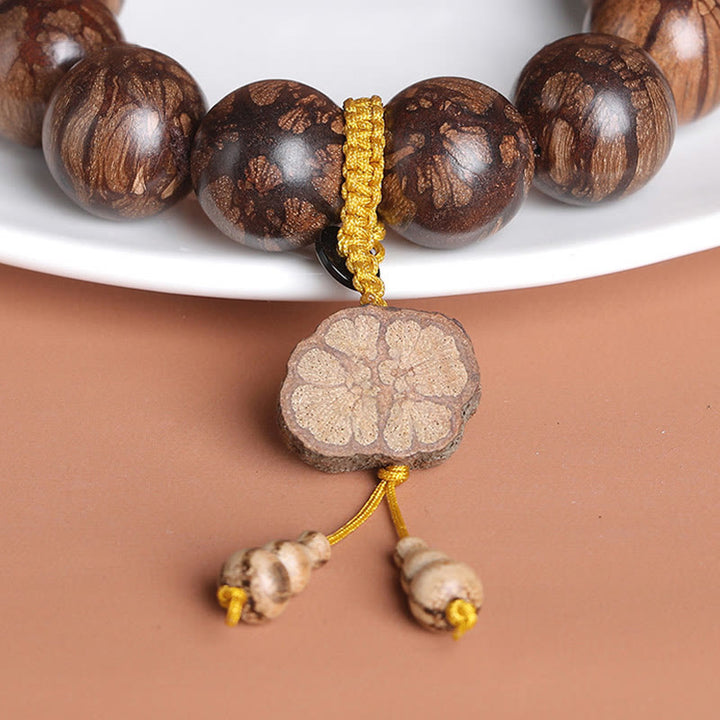 Pulsera de paz interior de madera de ciruelo con piedras de Buda