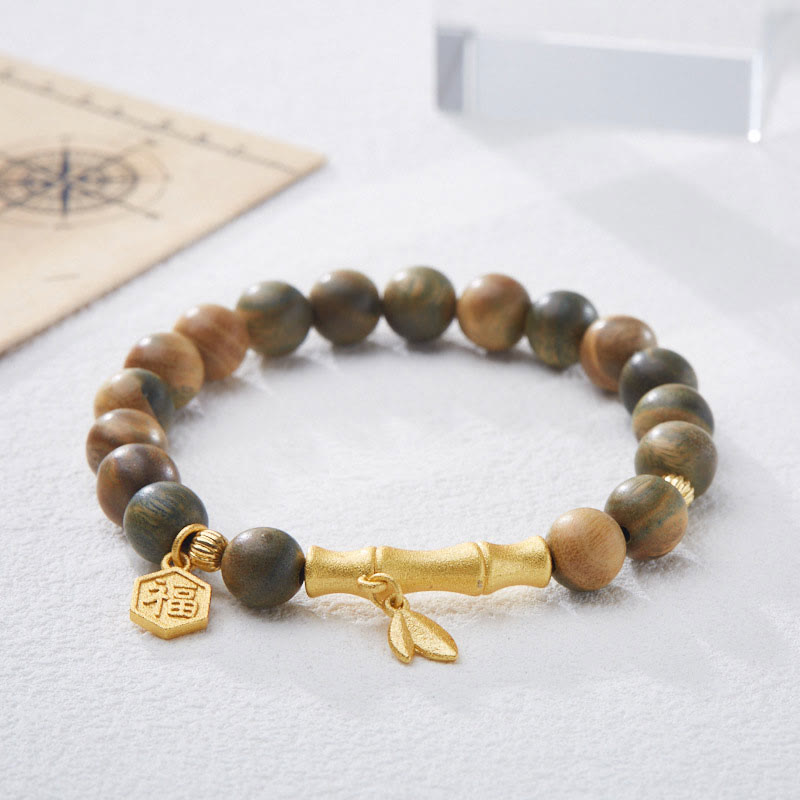 Pulsera calmante de bambú con carácter Fu de madera de sándalo verde Buddha Stones