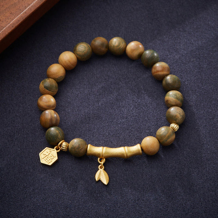 Pulsera calmante de bambú con carácter Fu de madera de sándalo verde Buddha Stones