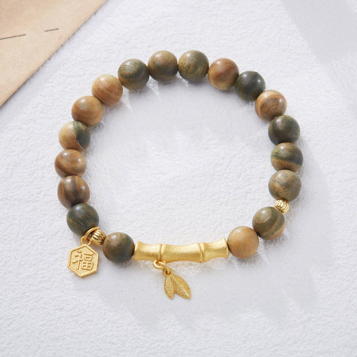 Pulsera calmante de bambú con carácter Fu de madera de sándalo verde Buddha Stones