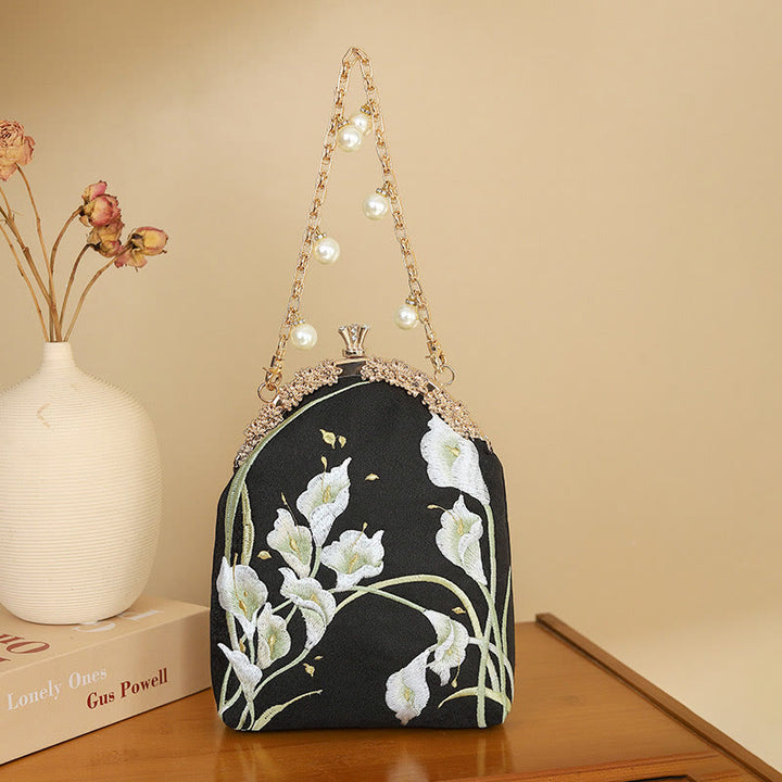 Bolso de mano con asa de metal bordado de calas y piedras de Buda, bolso bandolera