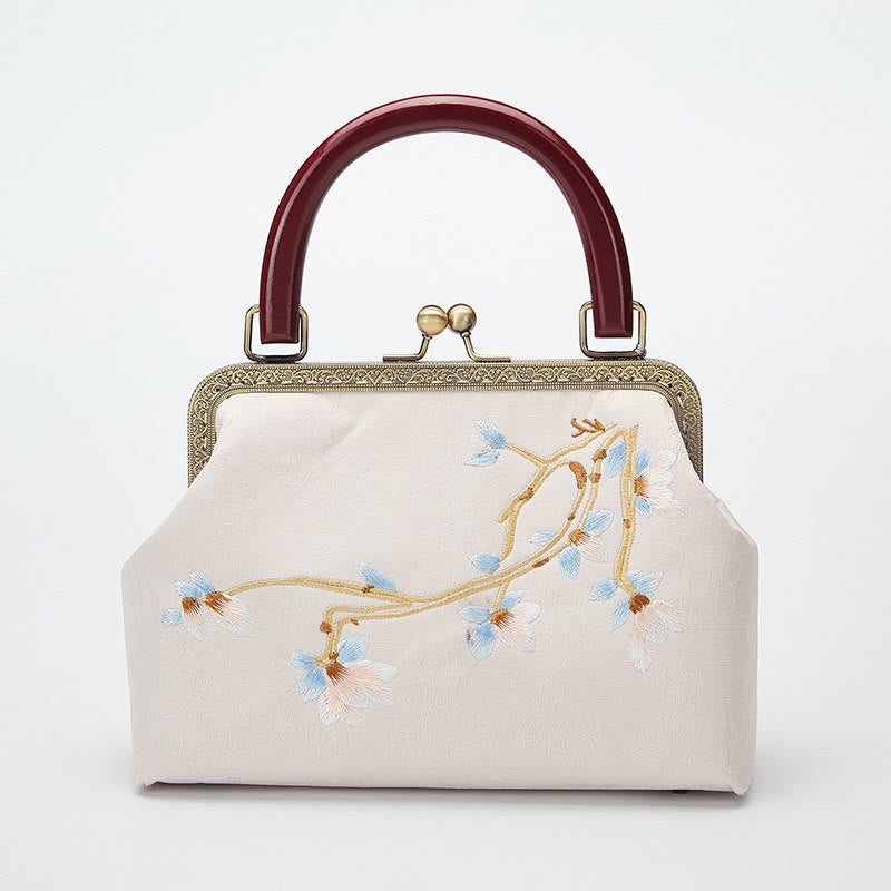 Bolso cruzado con bordado de flores y piedras de Buda