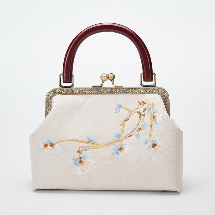 Bolso cruzado con bordado de flores y piedras de Buda