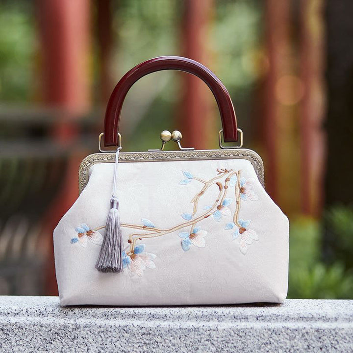 Bolso cruzado con bordado de flores y piedras de Buda