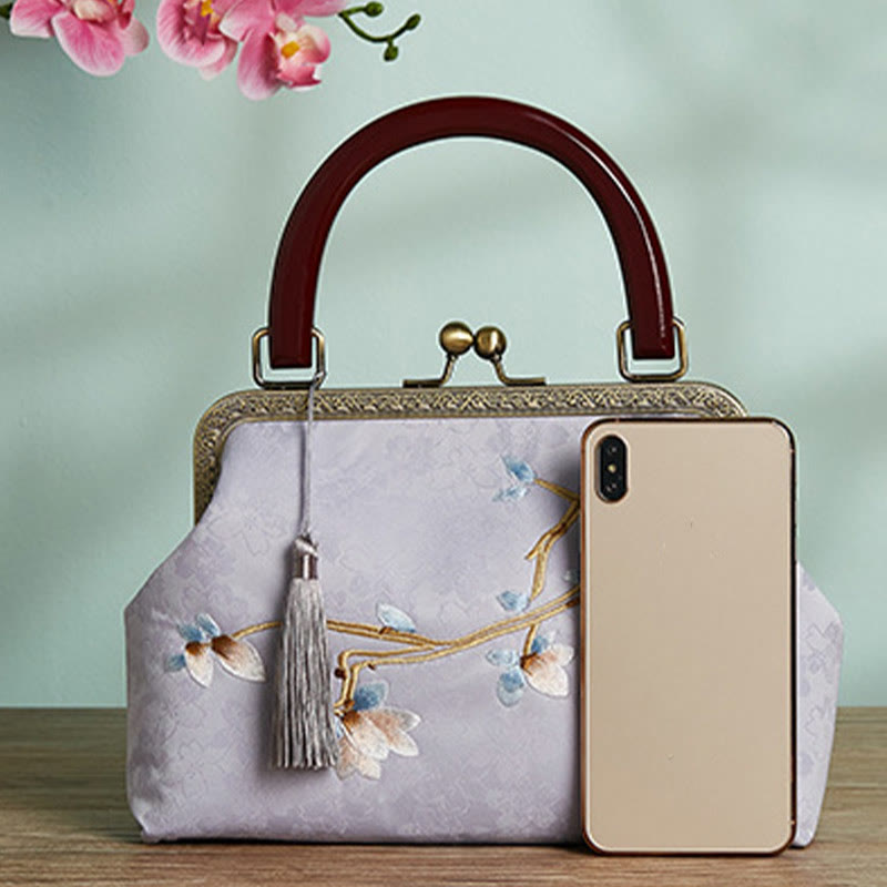 Bolso cruzado con bordado de flores y piedras de Buda