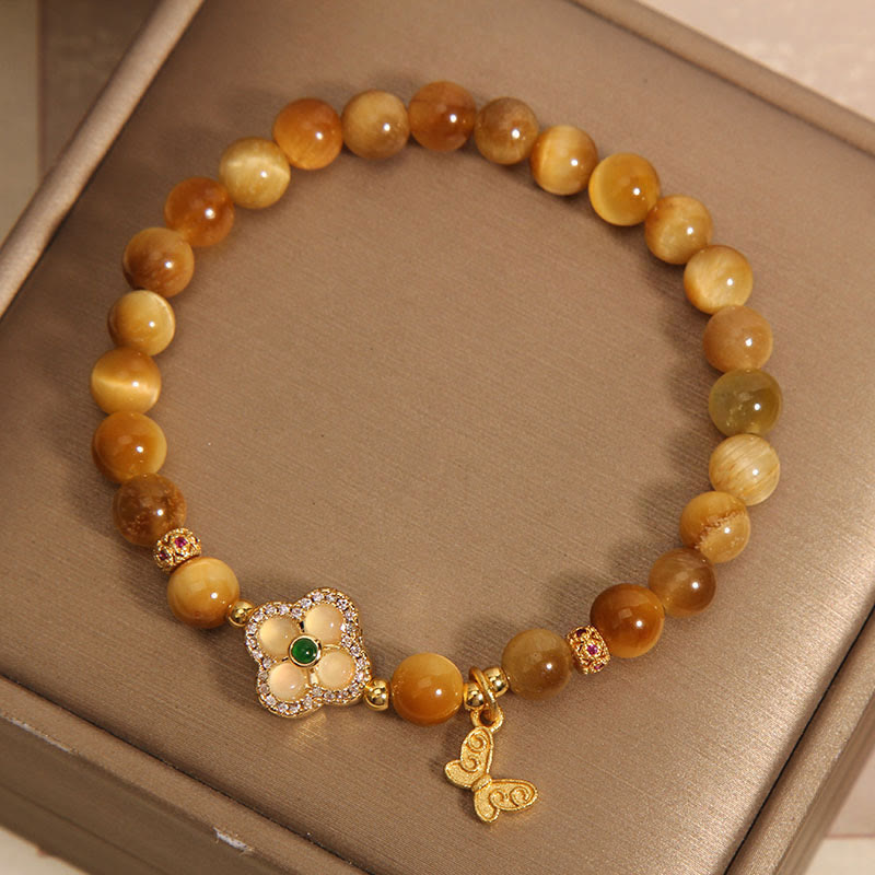 Pulsera de protección con ojo de tigre, trébol de cuatro hojas y mariposa de Buddha Stones
