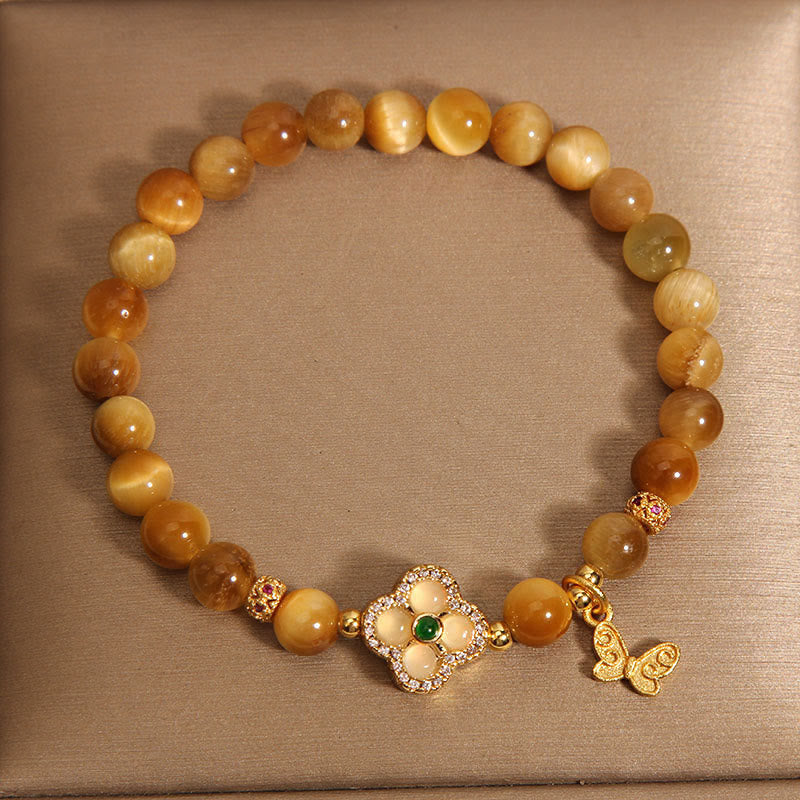 Pulsera de protección con ojo de tigre, trébol de cuatro hojas y mariposa de Buddha Stones