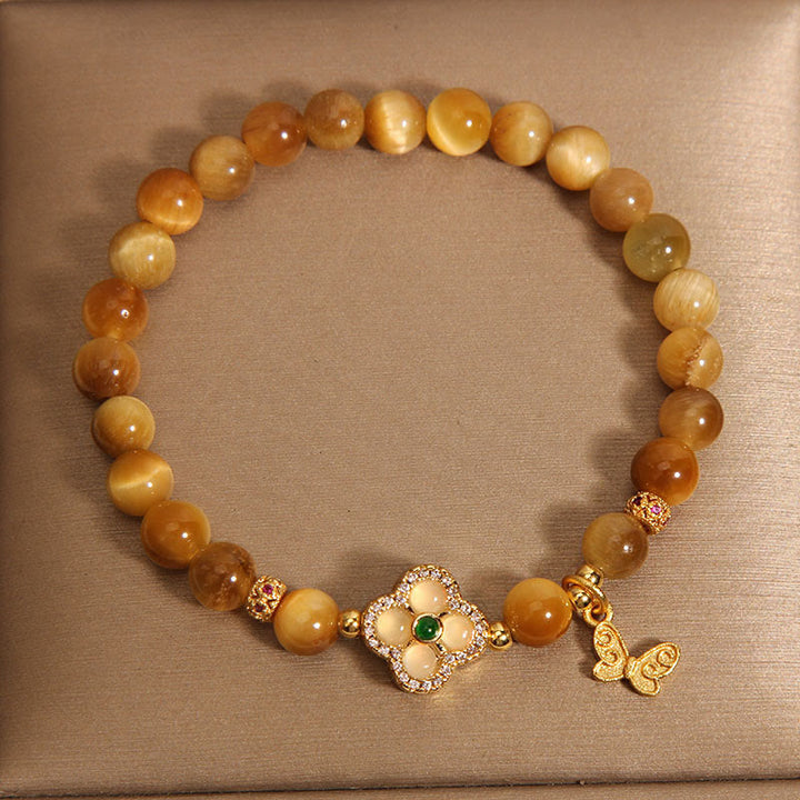Pulsera de protección con ojo de tigre, trébol de cuatro hojas y mariposa de Buddha Stones