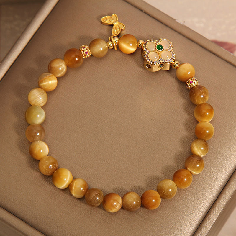 Pulsera de protección con ojo de tigre, trébol de cuatro hojas y mariposa de Buddha Stones