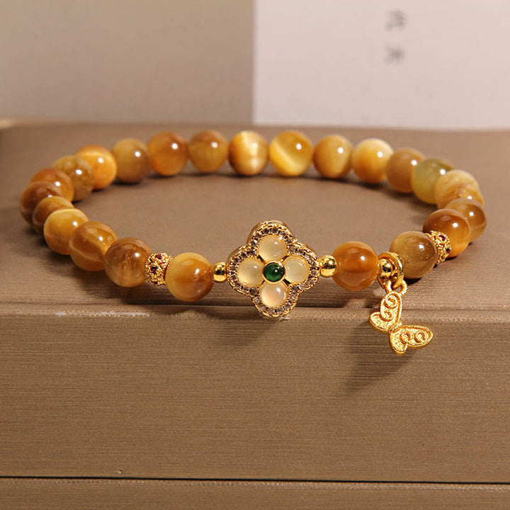Pulsera de protección con ojo de tigre, trébol de cuatro hojas y mariposa de Buddha Stones