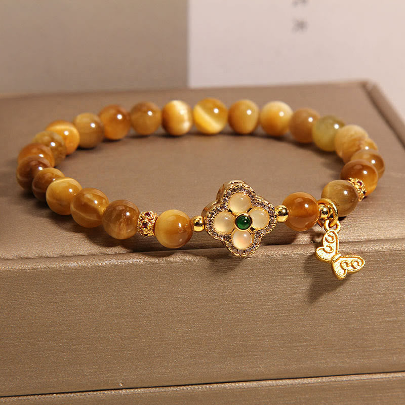 Pulsera de protección con ojo de tigre, trébol de cuatro hojas y mariposa de Buddha Stones