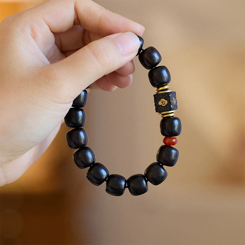 Buddha Stones Pulsera de Madera de Ébano con Nubes Auspiciosas Grabadas para la Calma