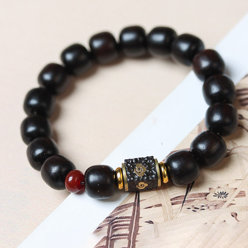 Buddha Stones Pulsera de Madera de Ébano con Nubes Auspiciosas Grabadas para la Calma