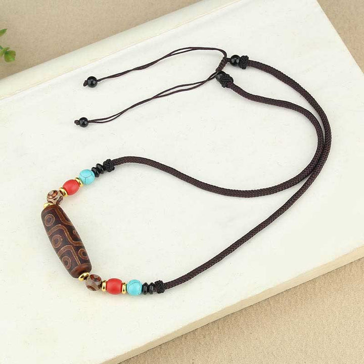 Buddha Stones Collar colgante de abalorio Dzi tibetano de nueve ojos de Dzi de tres ojos cuerda protectora