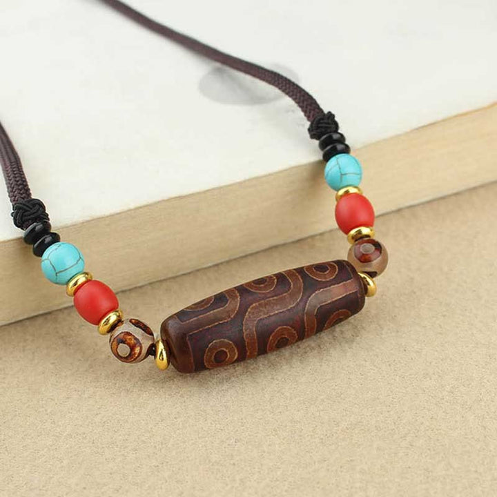 Buddha Stones Collar colgante de abalorio Dzi tibetano de nueve ojos de Dzi de tres ojos cuerda protectora