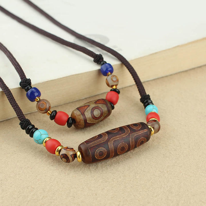 Buddha Stones Collar colgante de abalorio Dzi tibetano de nueve ojos de Dzi de tres ojos cuerda protectora