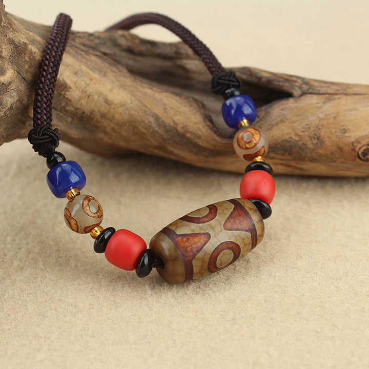 Buddha Stones Collar colgante de abalorio Dzi tibetano de nueve ojos de Dzi de tres ojos cuerda protectora